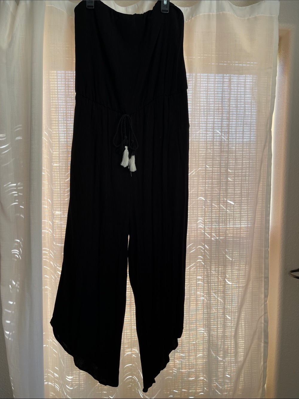 Xhilaration Black Strapless Wide-Leg Jumpsuit with Tassel Tie and crop length.